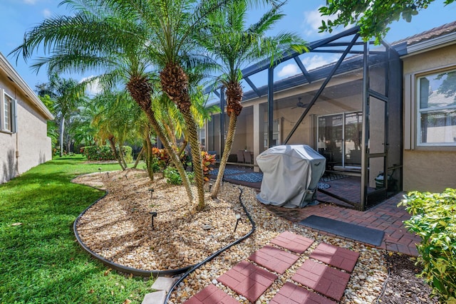 view of yard with a lanai and a patio