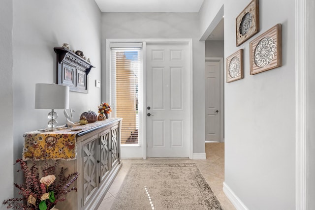 entryway with light tile patterned flooring