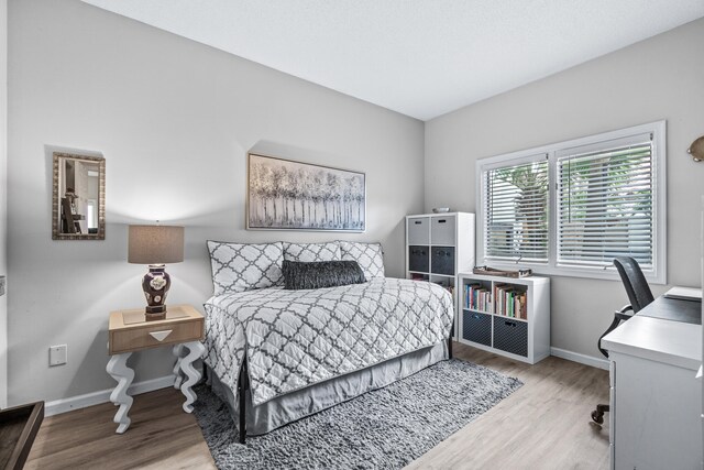 bedroom with light hardwood / wood-style flooring