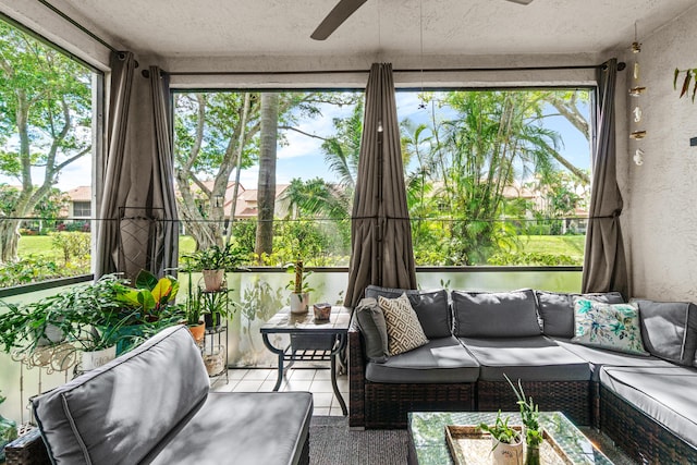 sunroom / solarium featuring ceiling fan