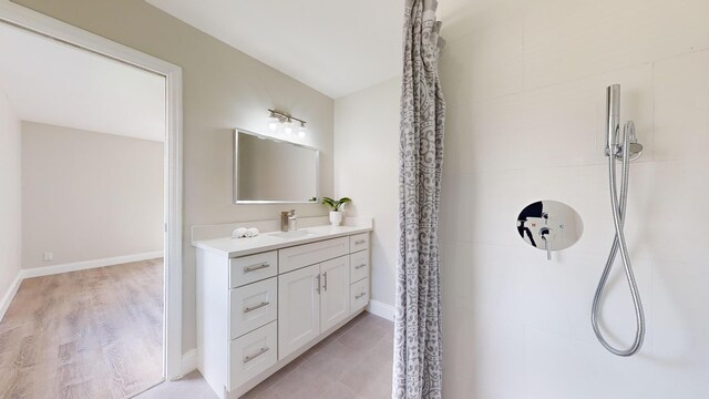 bathroom featuring walk in shower, vanity, and toilet