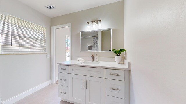 bathroom with walk in shower, vanity, and hardwood / wood-style flooring