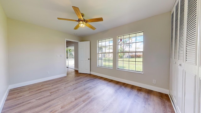 unfurnished bedroom with light hardwood / wood-style flooring and ceiling fan