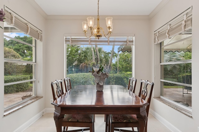 tiled dining room with a chandelier and ornamental molding