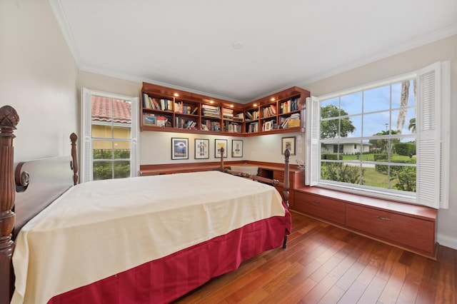 bedroom with crown molding and dark wood-type flooring