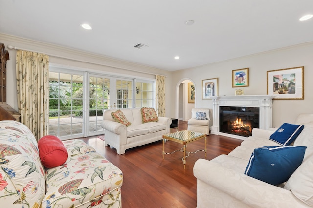 living room with french doors, dark hardwood / wood-style floors, and ornamental molding