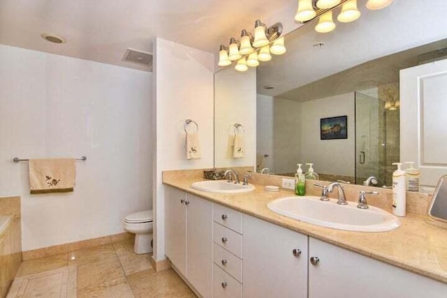 full bathroom featuring independent shower and bath, vanity, and toilet