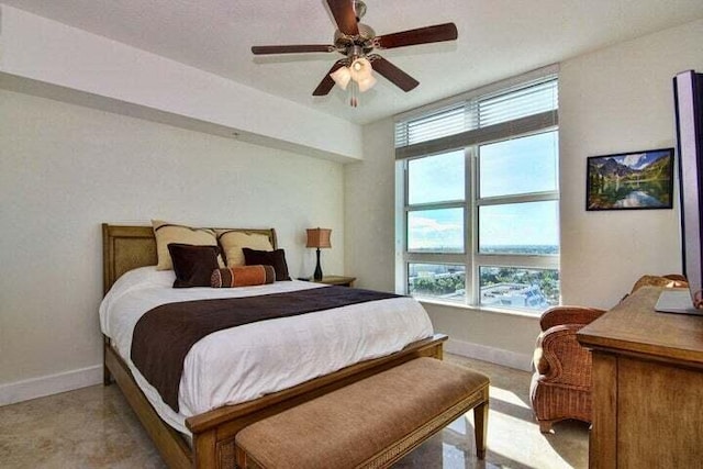 bedroom with multiple windows and ceiling fan