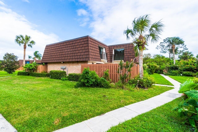 view of home's exterior with a yard