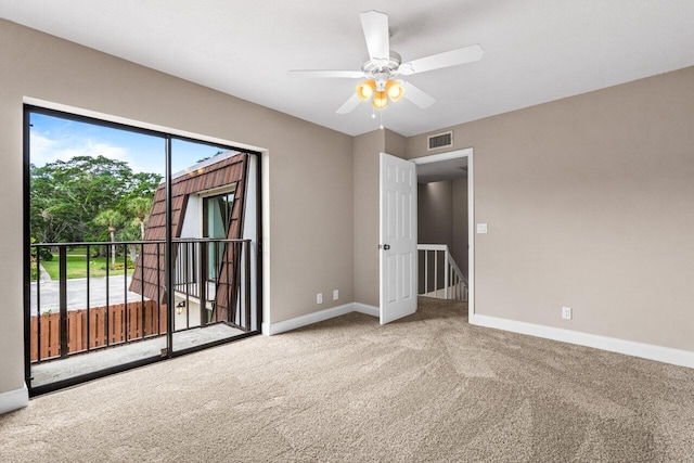 spare room with carpet and ceiling fan