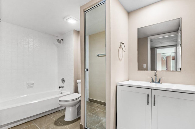 full bathroom featuring tile patterned flooring, vanity, tiled shower / bath combo, and toilet