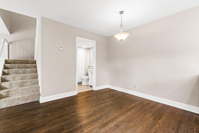 spare room with dark hardwood / wood-style floors