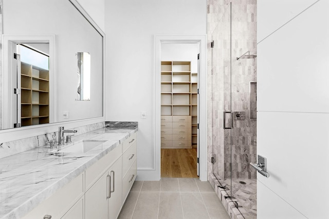 bathroom with vanity, tile patterned floors, and an enclosed shower