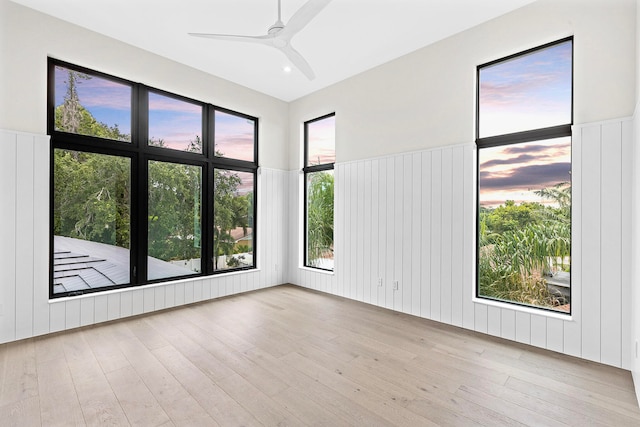 spare room featuring light wood-type flooring and ceiling fan