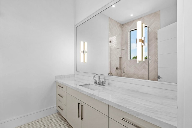 bathroom with vanity, tile patterned floors, and a shower with shower door