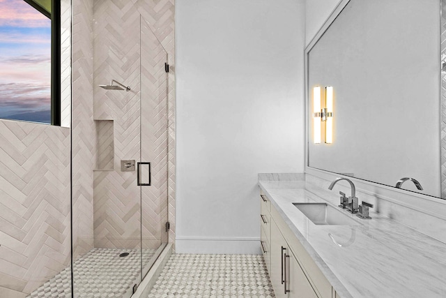 bathroom with vanity and a shower with shower door