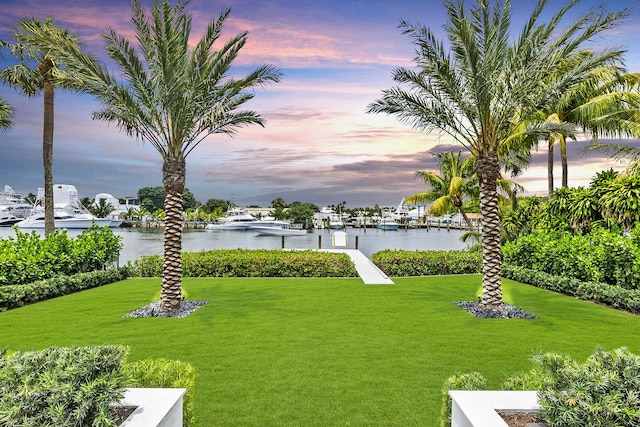 yard at dusk with a water view