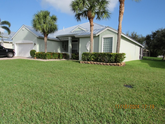 single story home with a garage and a front yard