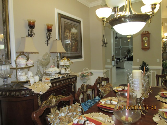 dining area featuring crown molding