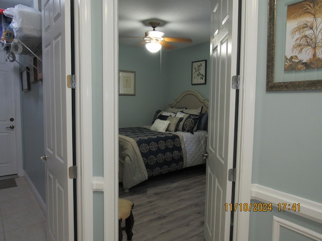 bedroom featuring hardwood / wood-style floors and ceiling fan