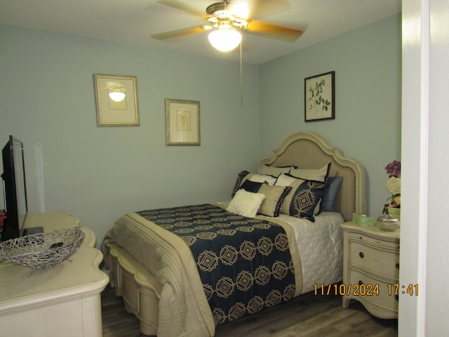 bedroom with hardwood / wood-style floors and ceiling fan