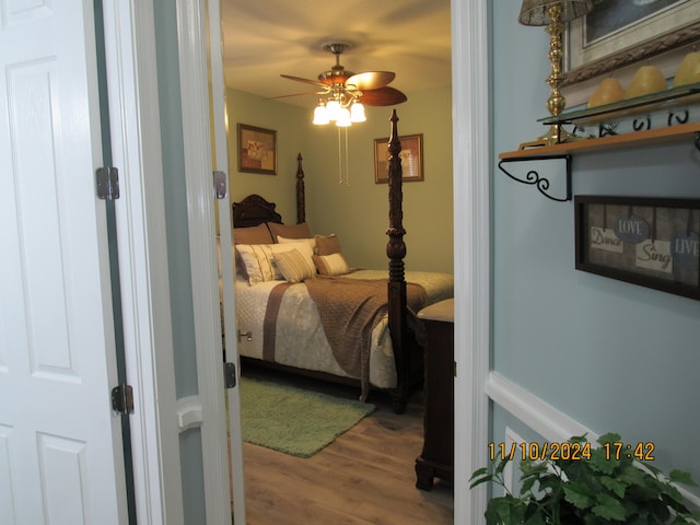 bedroom featuring hardwood / wood-style flooring and ceiling fan