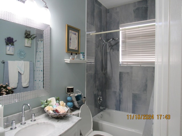 full bathroom featuring toilet, vanity, and shower / bath combo with shower curtain