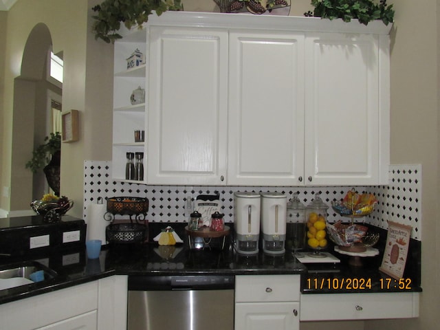 kitchen featuring white cabinetry, stainless steel dishwasher, and tasteful backsplash