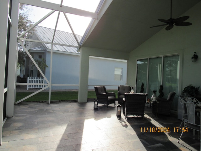 view of patio with a lanai and ceiling fan