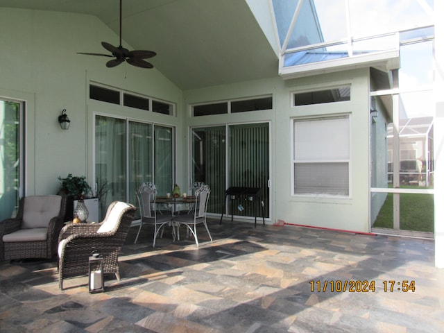 view of patio / terrace featuring ceiling fan and a lanai