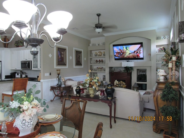 dining area featuring ornamental molding, ceiling fan, and light tile patterned flooring