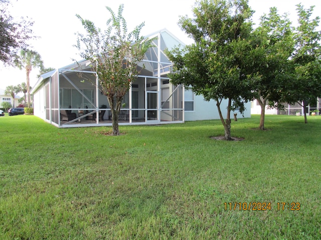 view of yard featuring glass enclosure