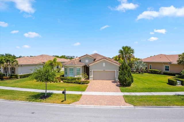 view of front of house with a garage and a front yard