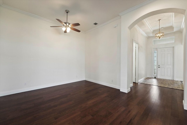 foyer with ceiling fan with notable chandelier, dark hardwood / wood-style floors, and crown molding