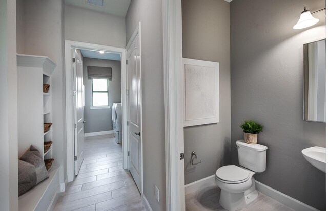 bedroom featuring baseboards, wood finished floors, a notable chandelier, and ornamental molding