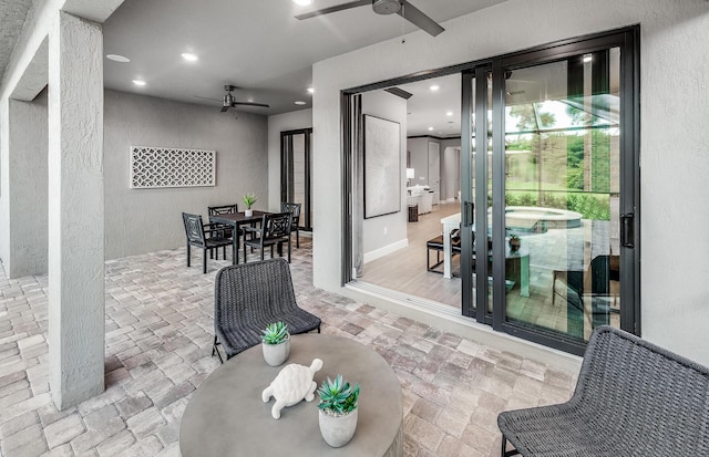 view of patio / terrace featuring outdoor dining space and a ceiling fan