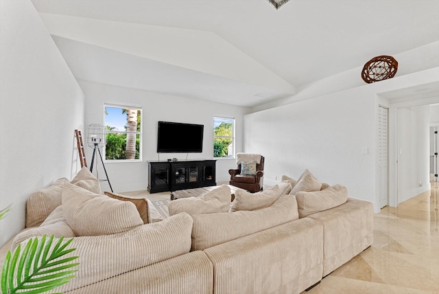 living room with plenty of natural light and lofted ceiling