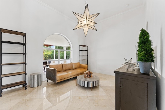 living room with a notable chandelier and crown molding