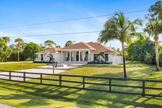 view of front of property with covered porch and a front yard