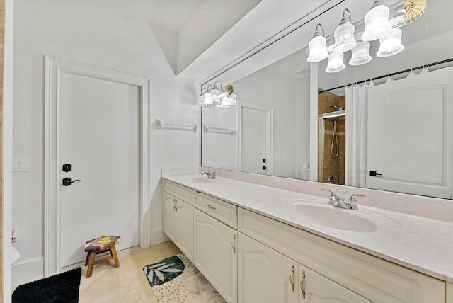 bathroom featuring vanity, tile patterned floors, and a shower with door