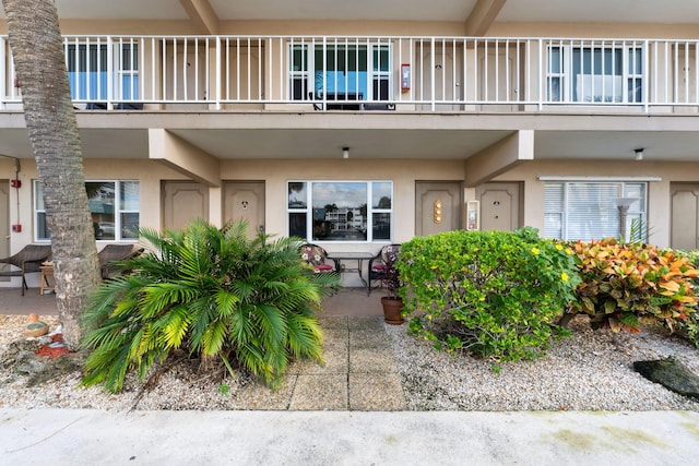 property entrance with a patio