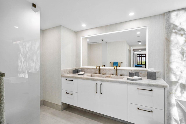 bathroom with tile patterned floors and vanity