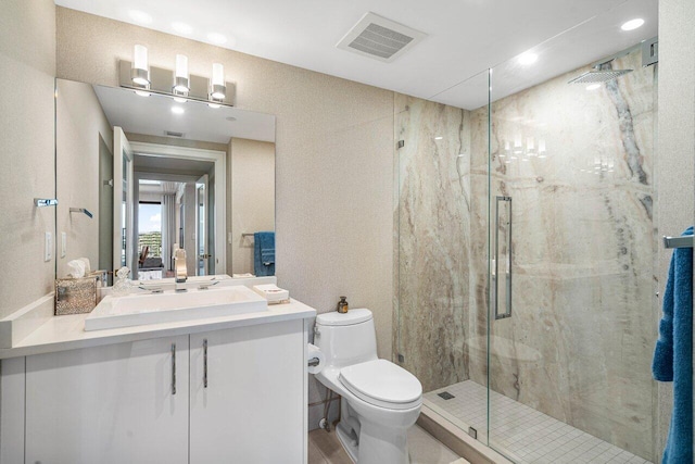 bathroom with an enclosed shower, vanity, toilet, and hardwood / wood-style flooring