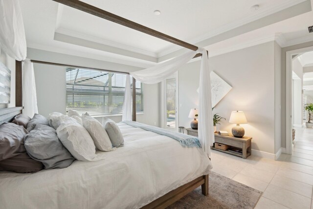 interior space featuring ornamental molding, light tile patterned flooring, and a healthy amount of sunlight