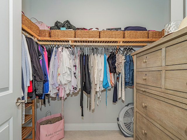 spacious closet featuring light tile patterned flooring