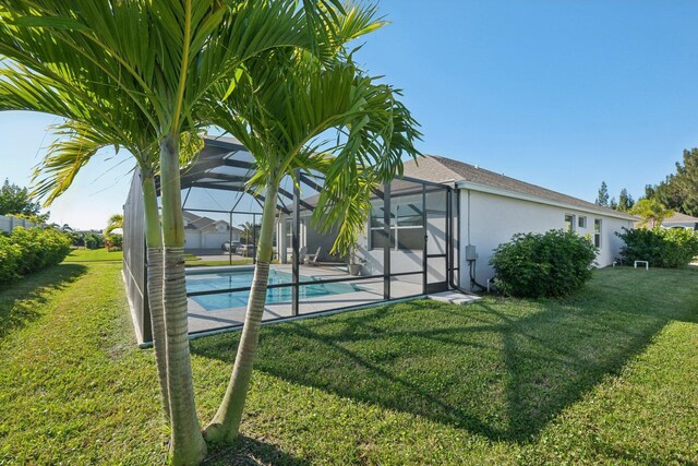 view of swimming pool with a lanai and a patio area