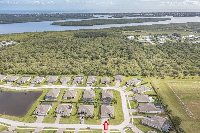 drone / aerial view with a water view