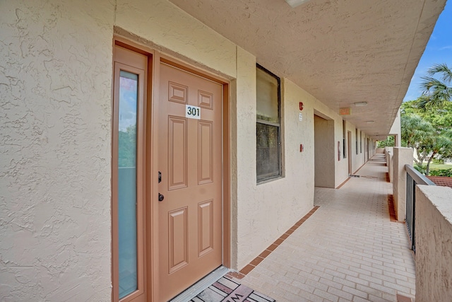 doorway to property featuring a porch