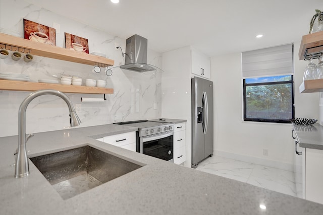 kitchen featuring white cabinetry, sink, wall chimney exhaust hood, stainless steel appliances, and backsplash