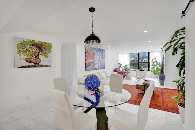 dining space featuring expansive windows